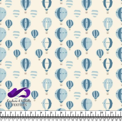 Various blue hot air balloons on beige background